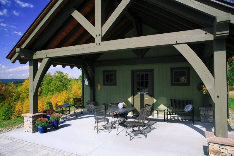 Wide view of the open timber frame porch on the pool house