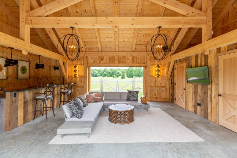Timber Frame Pool House Interior with Doors on Both Sides Open for Cool Breezes