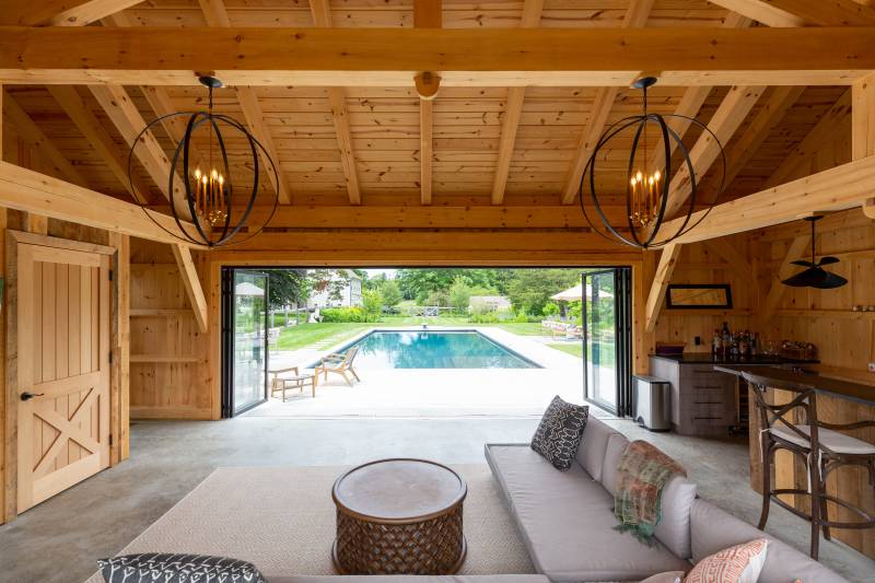 View of the Pool from the Timber Frame Pool House with Nana Doors Open