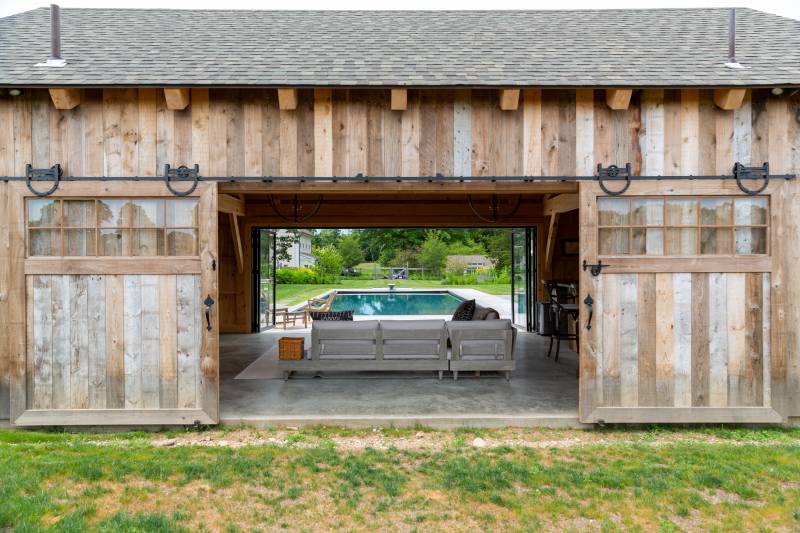 Sliding Barn Doors with Glass and Horseshoe Track on the Timber Frame Pool House