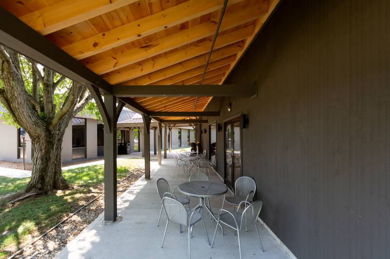 Under the 10' x 60' Timber Frame Open Lean-To • Outdoor Seating Area
