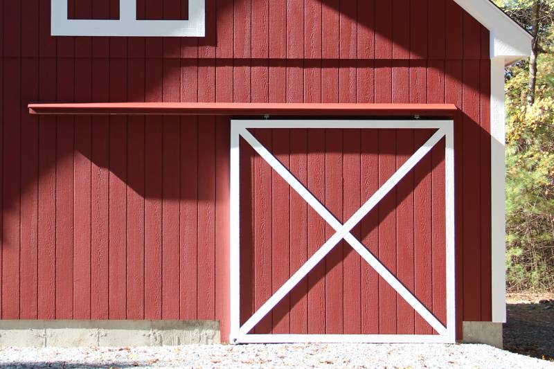 A Sliding Barn Door gives this Garage a Classic Barn Look