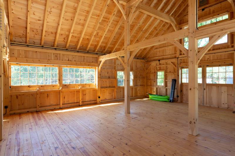 Half glass sliding barn doors and large interior floor space with cathedral ceilings