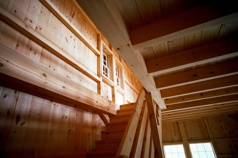 Looking up the stairway at the large timbers