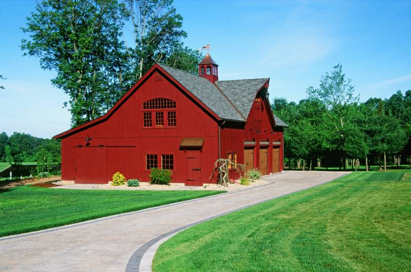Welcome home: approaching the barn garage on the paver driveway