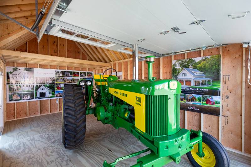 8,000 lb. John Deere Tractor inside the Grand Victorian Cape Garage