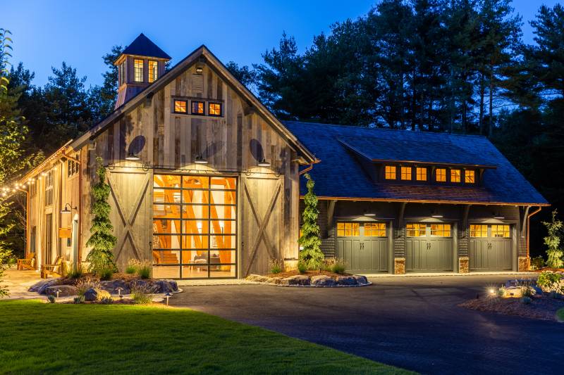 Custom Timber Frame Party Barn & 38' x 48' Carriage Barn At Night