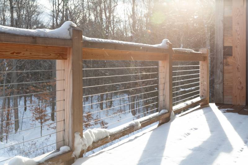 Stainless Steel Cable Railings • A Snowy Day • Covered Porch Railings