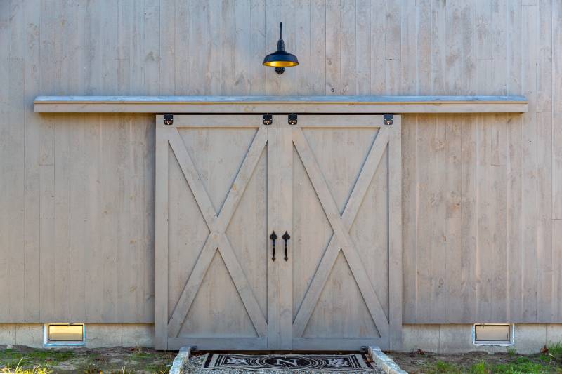 Sliding Barn Doors Conceal the Entryway