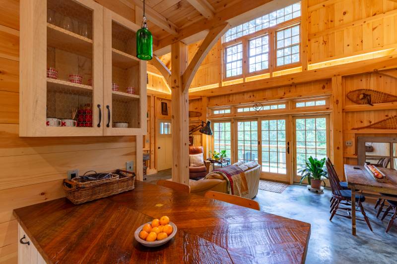 Looking Out of the Kitchen • Sliding Glass Doors with Transoms • Timber Frame Barn
